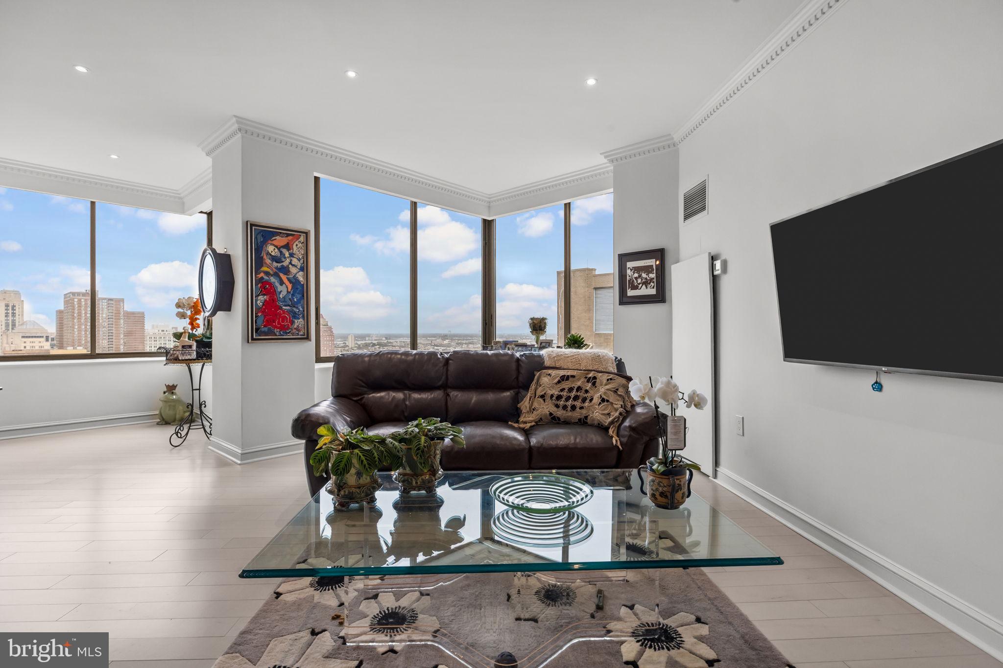 202 West Rittenhouse Square, Unit 2608 Philadelphia, PA 19103 - Photo 6 of 35 a living room with furniture and a flat screen tv