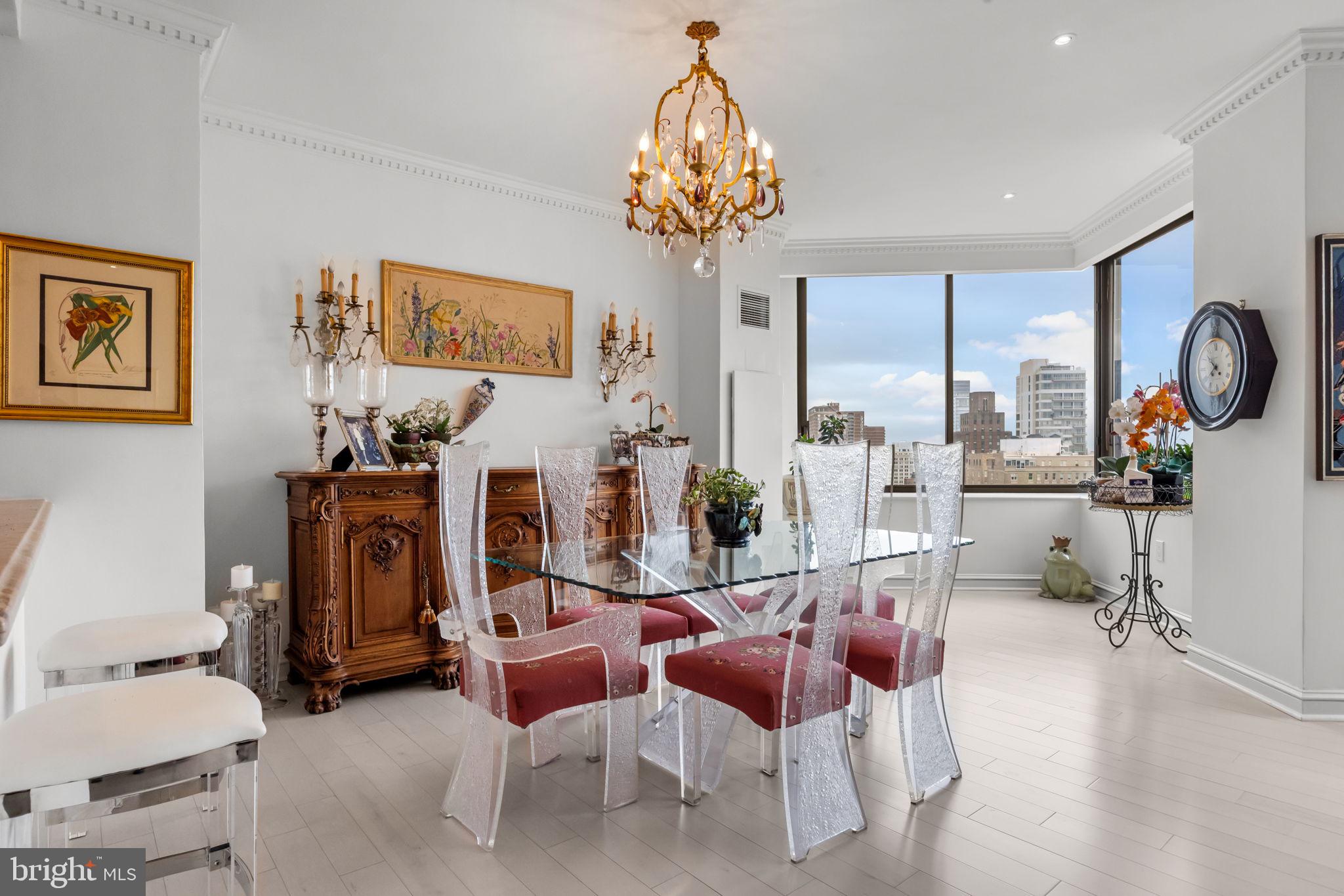 202 West Rittenhouse Square, Unit 2608 Philadelphia, PA 19103 - Photo 8 of 35 a living room with fireplace furniture and a chandelier
