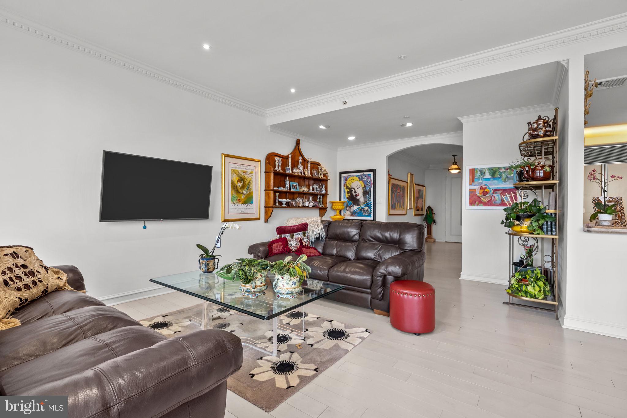 202 West Rittenhouse Square, Unit 2608 Philadelphia, PA 19103 - Photo 10 of 35 a living room with furniture and a flat screen tv