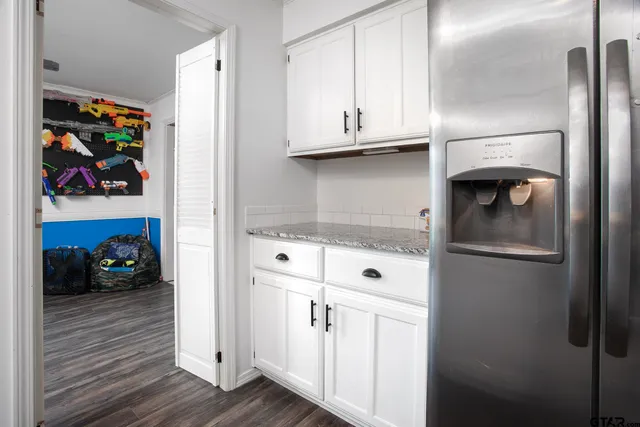 a kitchen with appliances and cabinets
