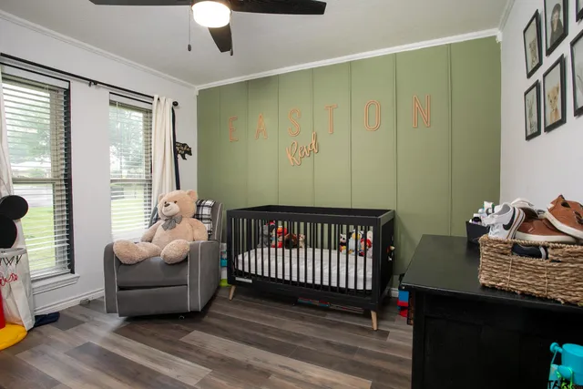 a bedroom with furniture and window