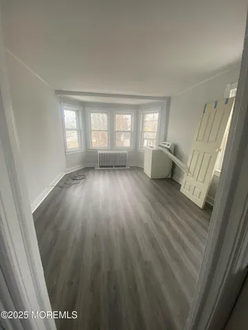 a view of livingroom with hardwood floor and window