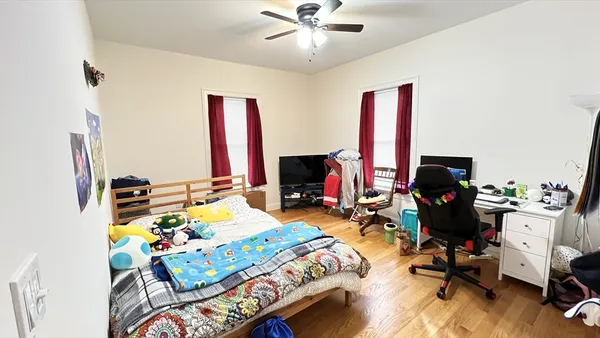 a bedroom with furniture and a fireplace
