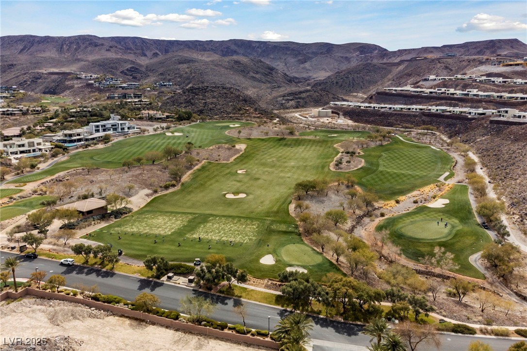 471 Cityview Ridge Drive Henderson, NV 89012 - Photo 25 of 28 Aerial view of property and surrounding area with mountains and a golf club