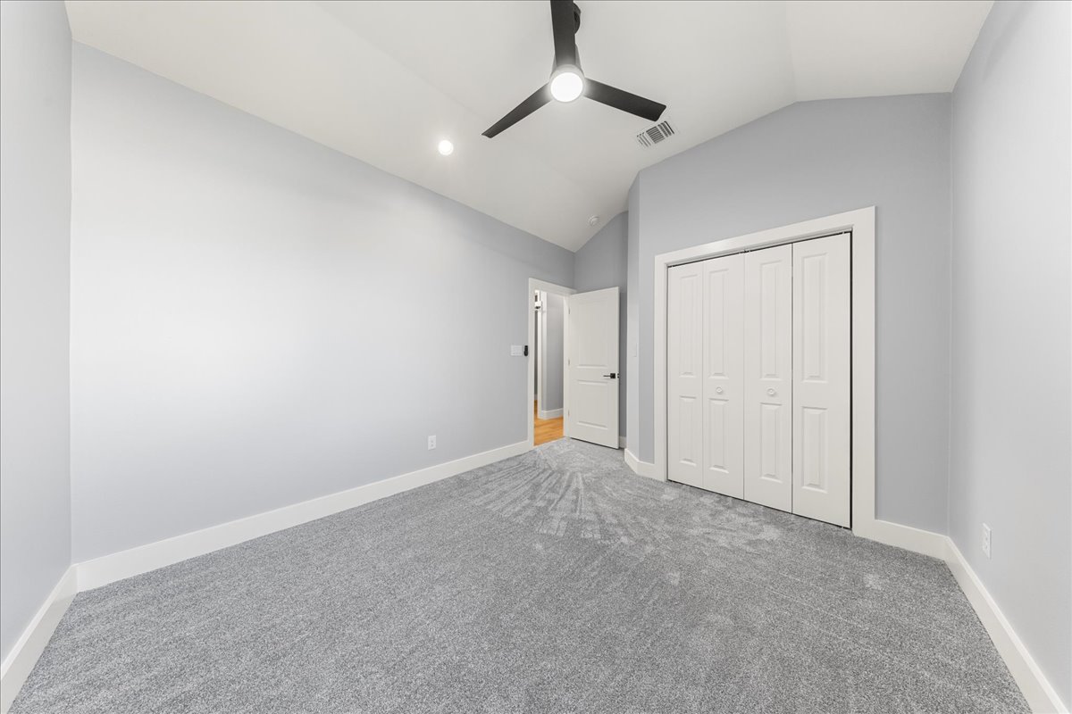 217 Gato Road Cedar Creek, TX 78612 - Photo 30 of 40 an empty room with chandelier fan