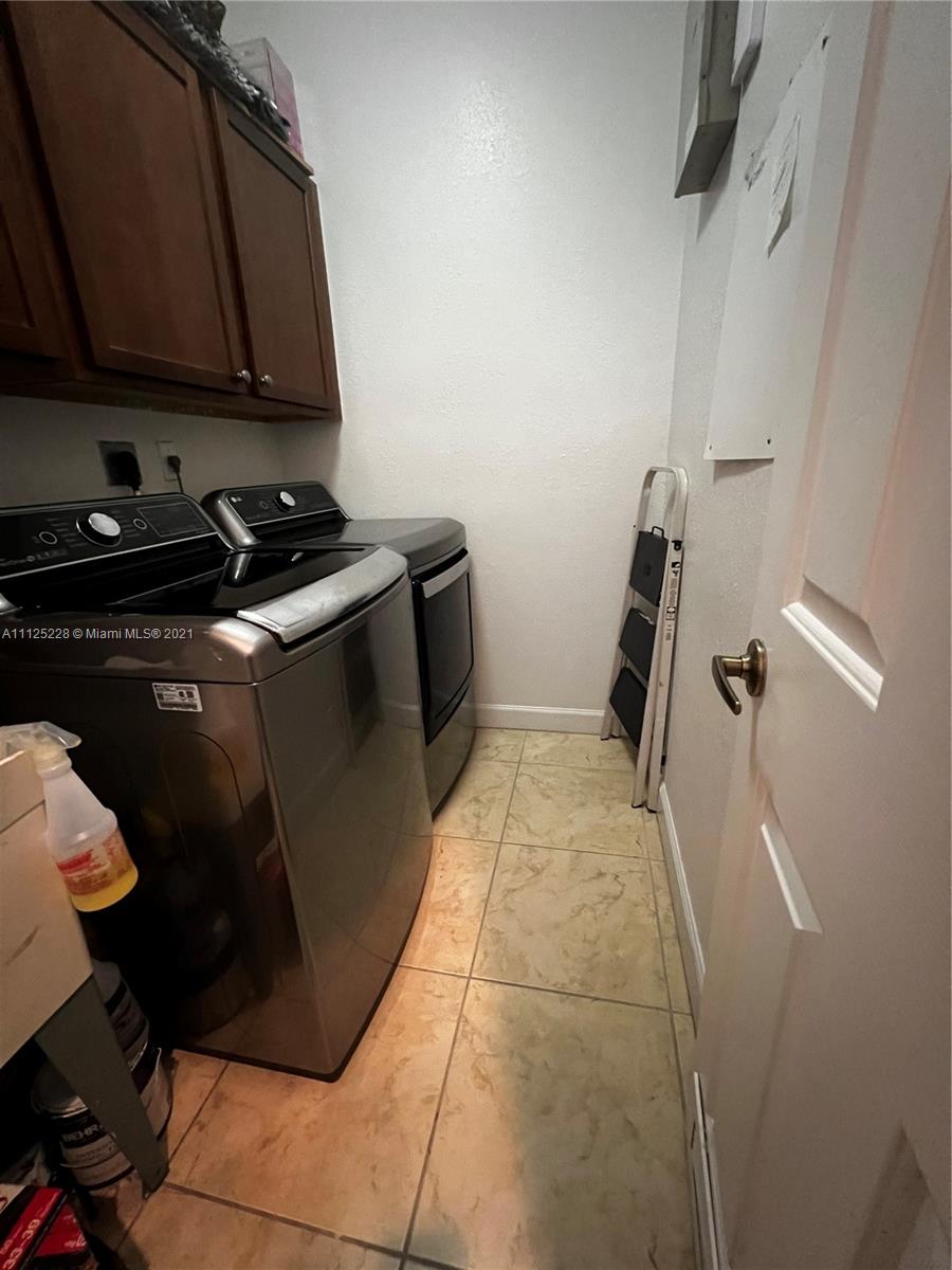 7985 Southwest 195th Street Cutler Bay, FL 33157 - Photo 3 of 16 a storage room with wooden floor