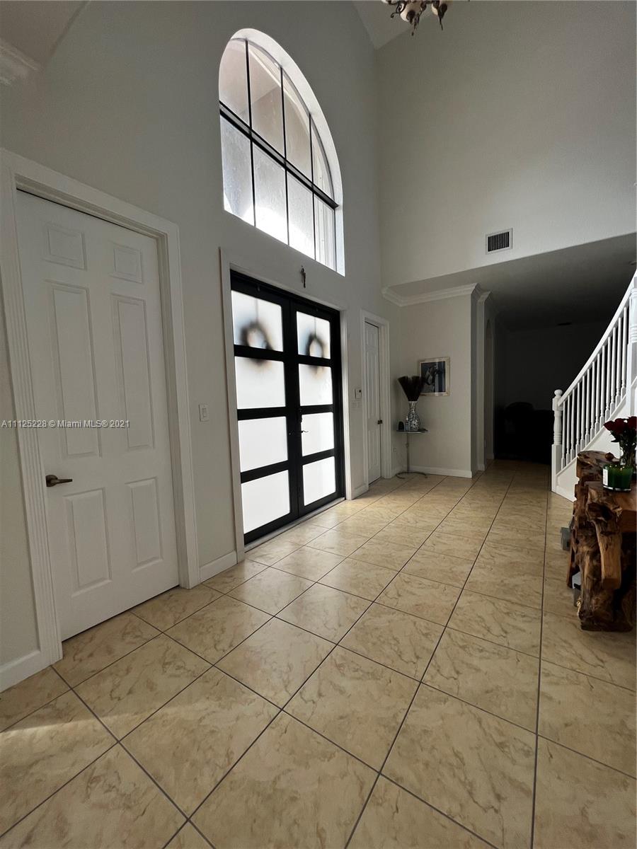 7985 Southwest 195th Street Cutler Bay, FL 33157 - Photo 7 of 16 a view of a livingroom with furniture and a window