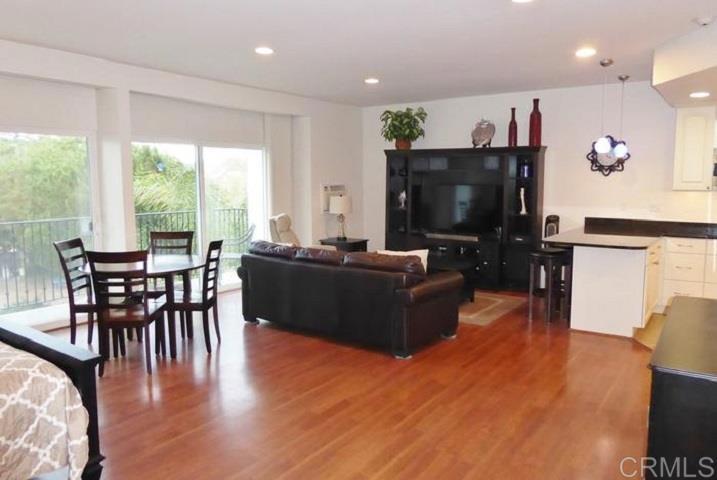 2005 Costa Del Mar Road, Unit 624 Carlsbad, CA 92009 - Photo 15 of 24 a living room with furniture and a flat screen tv