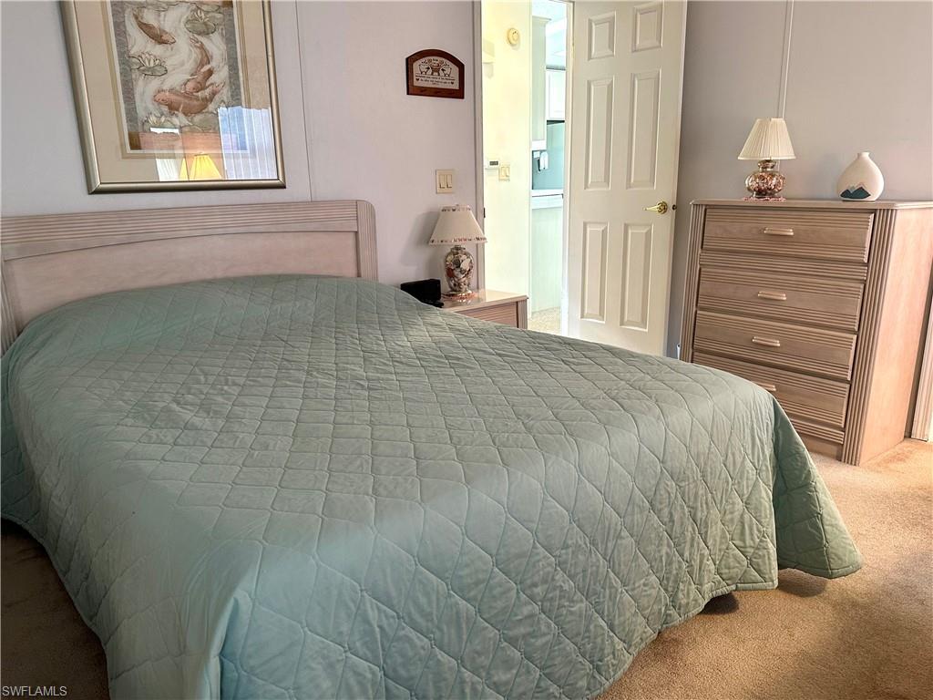 4680 Slash Pine Way West Estero, FL 33928 - Photo 14 of 20 a bedroom with a bed and a window