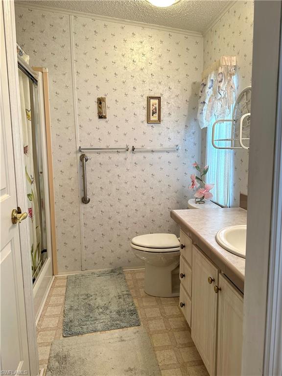 4680 Slash Pine Way West Estero, FL 33928 - Photo 16 of 20 a bathroom with a sink a toilet and shower