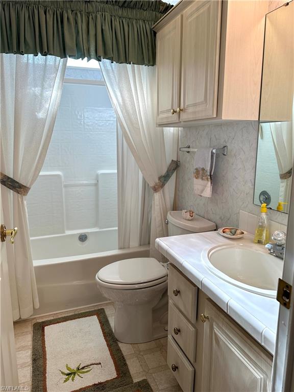 4680 Slash Pine Way West Estero, FL 33928 - Photo 20 of 20 a bathroom with a sink toilet and shower