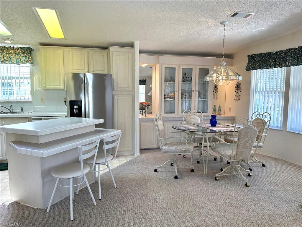 4680 Slash Pine Way West Estero, FL 33928 - Photo 5 of 20 a dining room with furniture and window