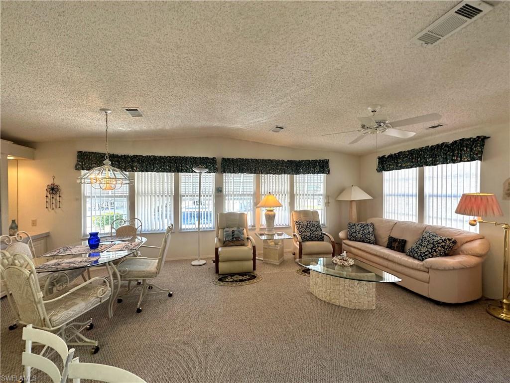4680 Slash Pine Way West Estero, FL 33928 - Photo 10 of 20 a living room with furniture and a large window