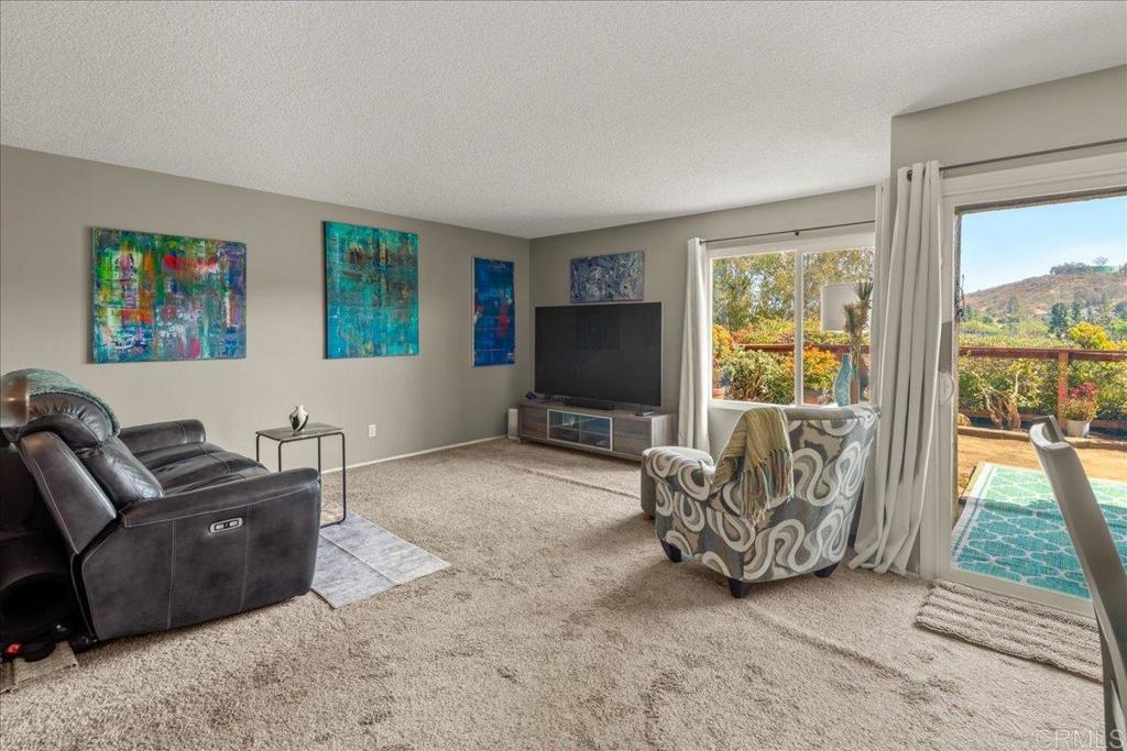 3047 Highlands Boulevard Spring Valley, CA 91977 - Photo 13 of 39 a living room with furniture and a flat screen tv