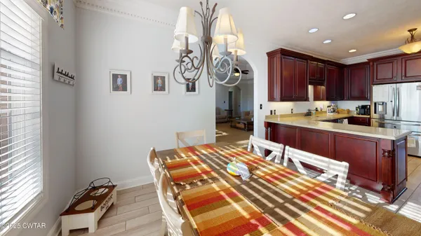 a kitchen with a sink appliances and cabinets