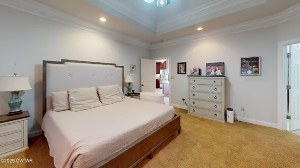 a bedroom with a bed and dresser