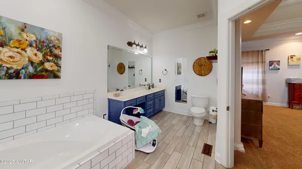 a bathroom with a tub and a sink