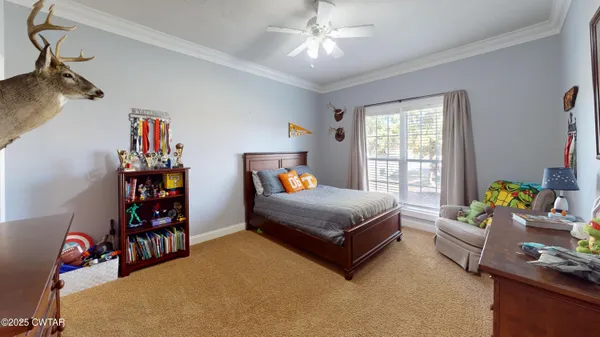 a bedroom with bed and a window