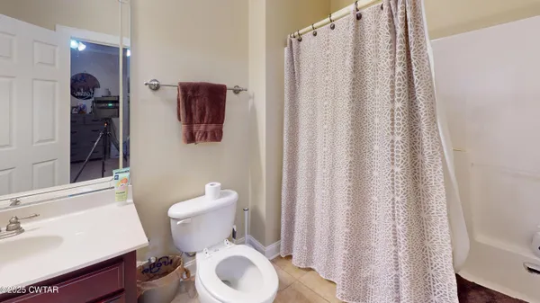 a white toilet sitting next to a bathroom sink