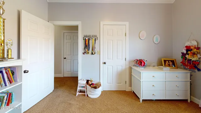 a view of room with furniture and closet