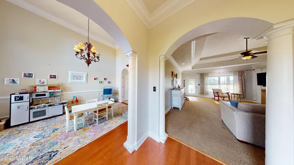 a view of a living room and dining room
