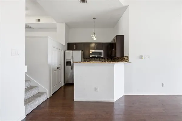 a view of a kitchen from the hallway
