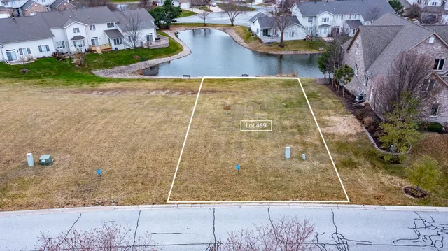 an aerial view of a house with a swimming pool