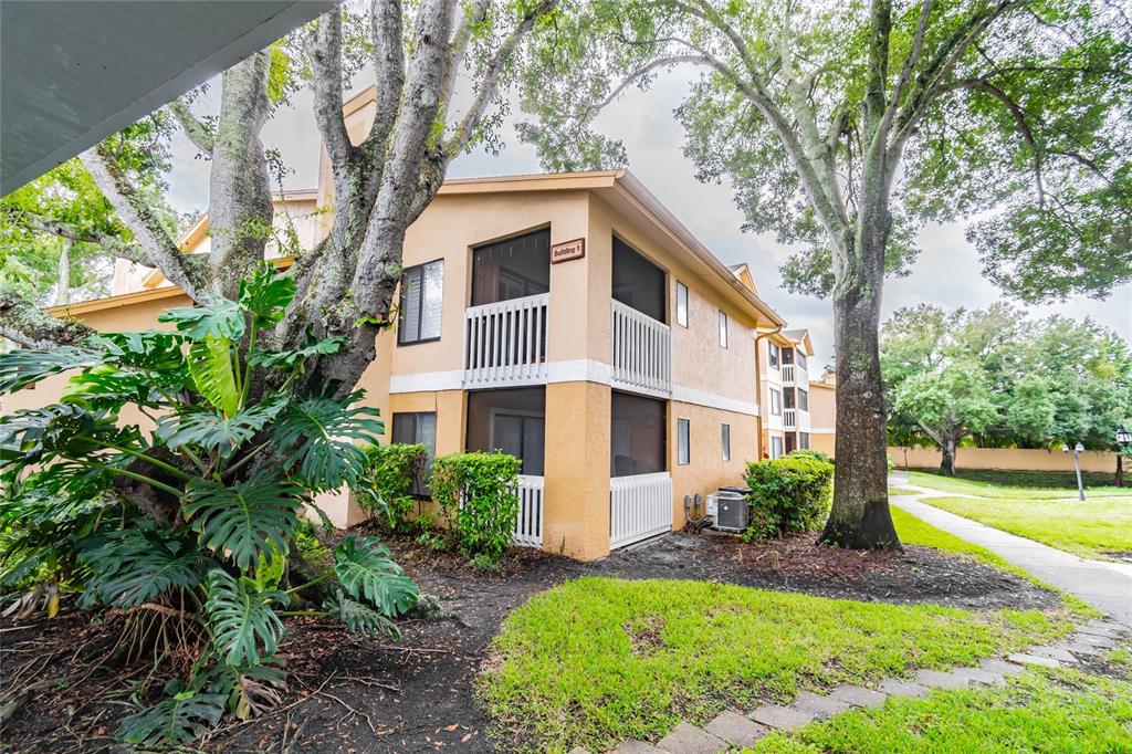 1550 South Belcher Road, Unit 117 Clearwater, FL 33764 - Photo 1 of 1 a front view of a house with a yard