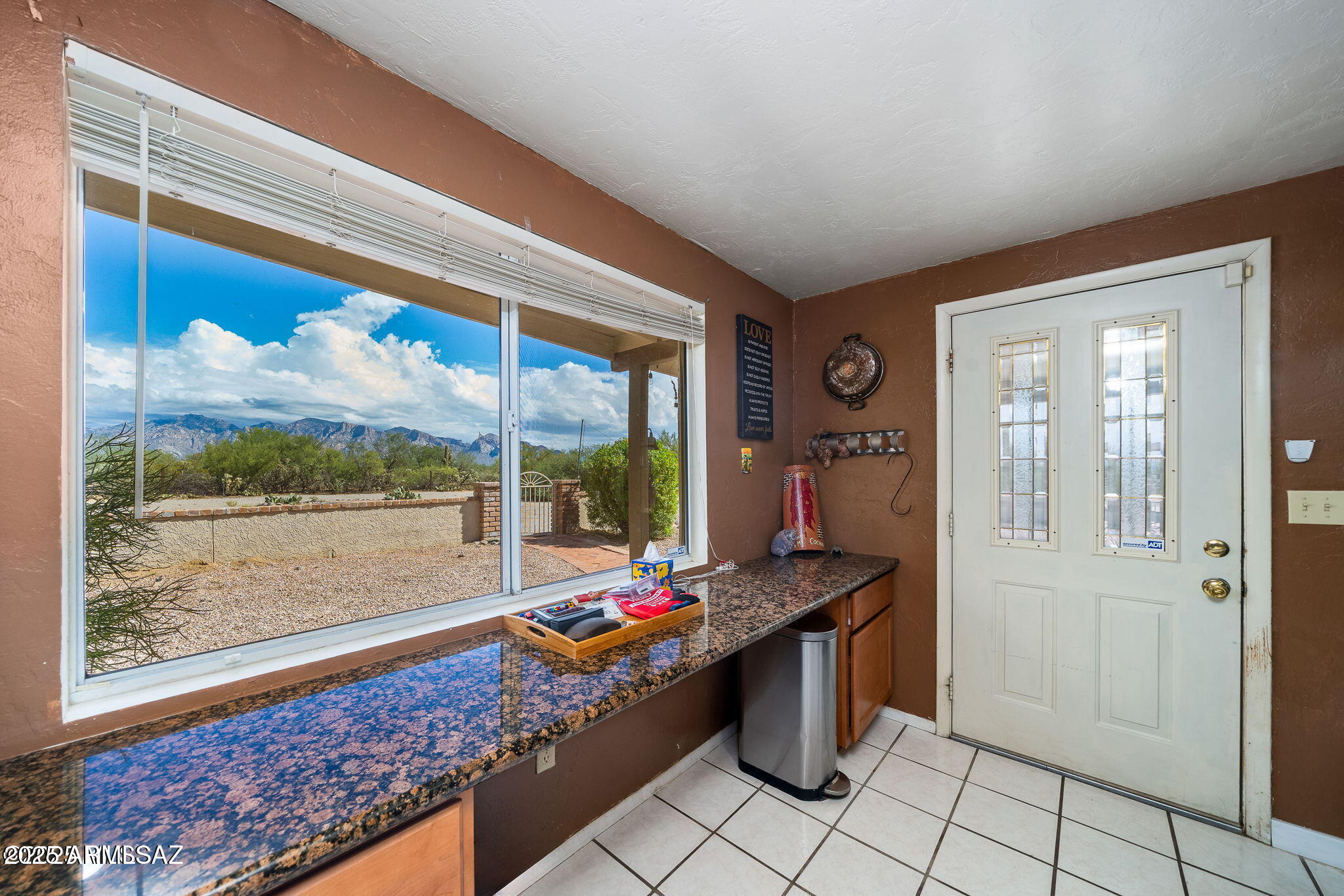 2350 West Sunkist Road Tucson, AZ 85755 - Photo 11 of 39 a living room with a rug and a table
