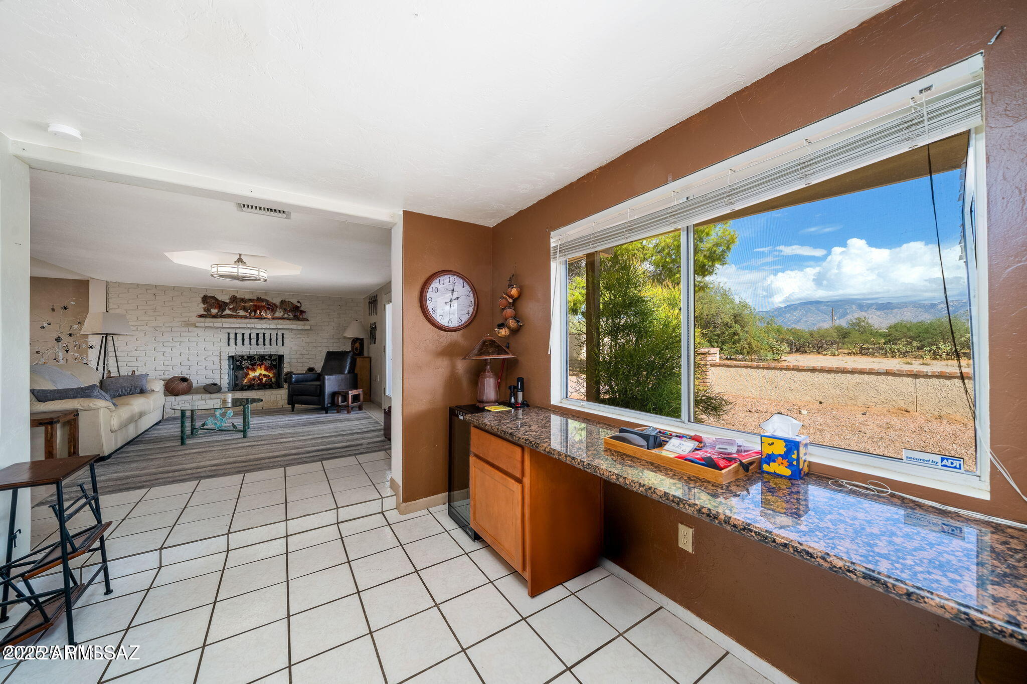 2350 West Sunkist Road Tucson, AZ 85755 - Photo 12 of 39 a living room with furniture and a flat screen tv