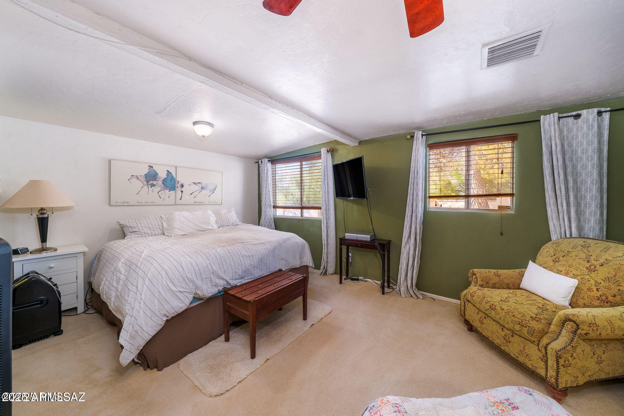 2350 West Sunkist Road Tucson, AZ 85755 - Photo 16 of 39 a spacious bedroom with a bed couch and window