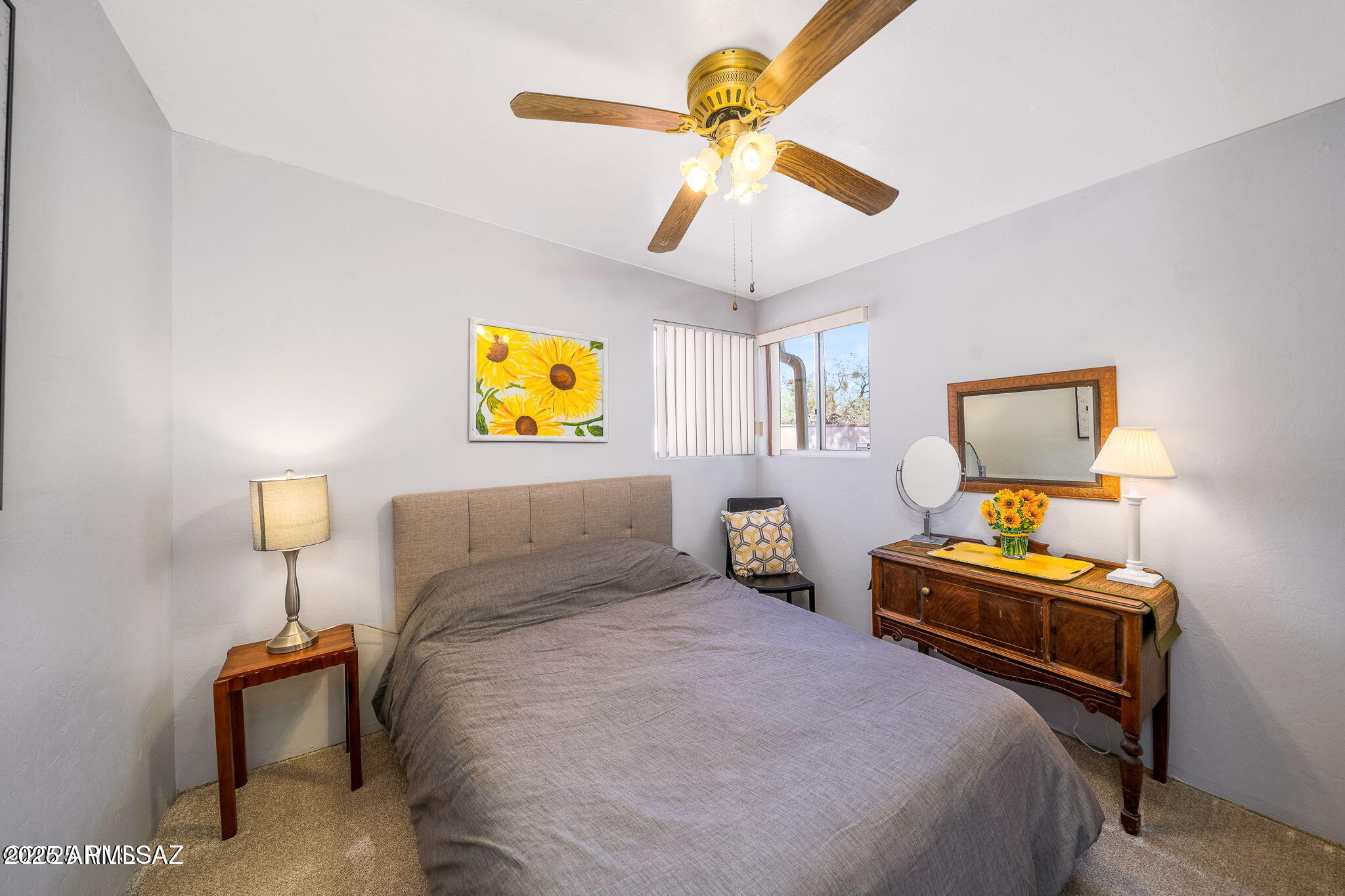 2350 West Sunkist Road Tucson, AZ 85755 - Photo 23 of 39 a bedroom with a bed and a chandelier