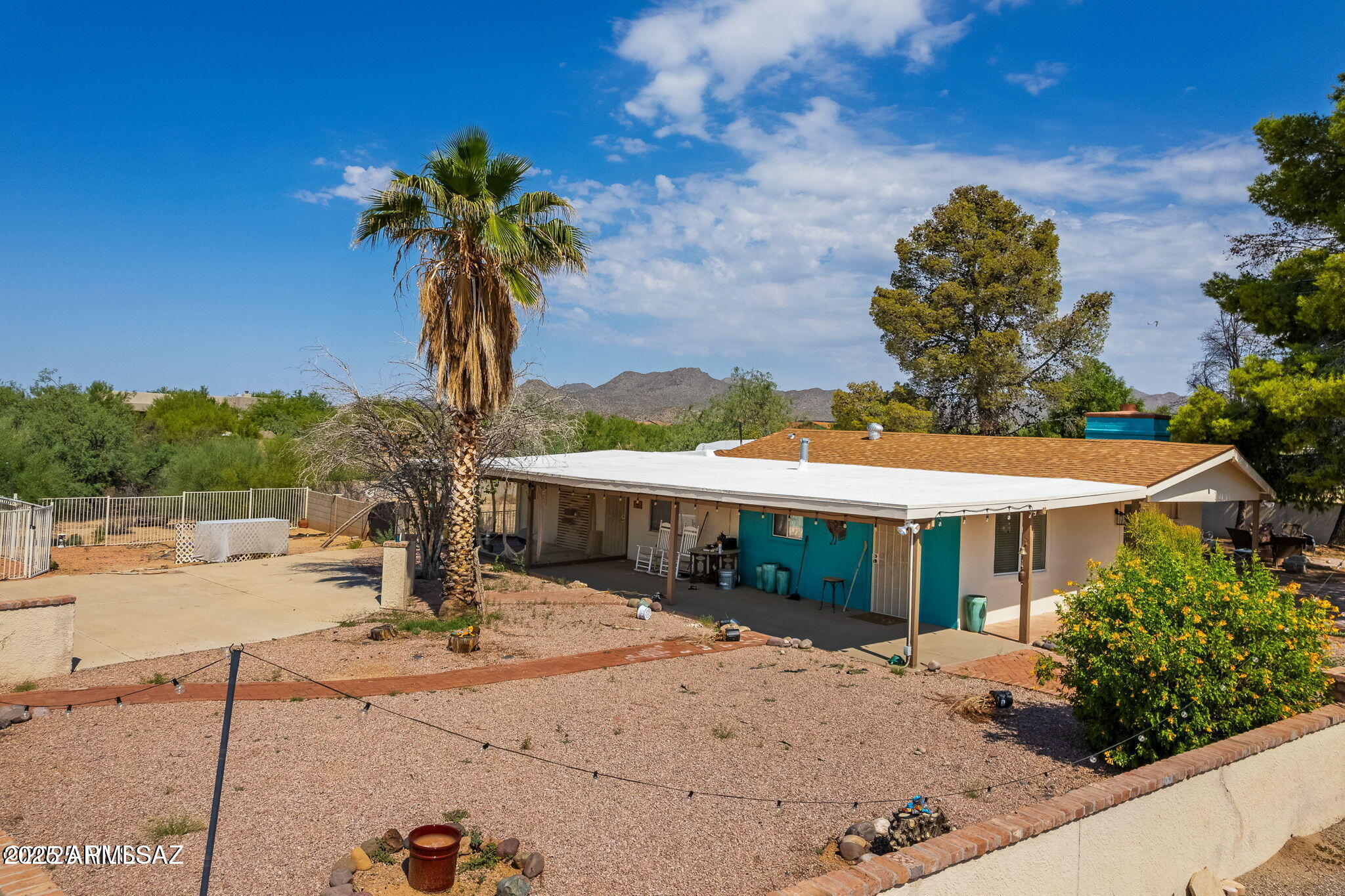 2350 West Sunkist Road Tucson, AZ 85755 - Photo 4 of 39 a view of a house with a yard and sitting area
