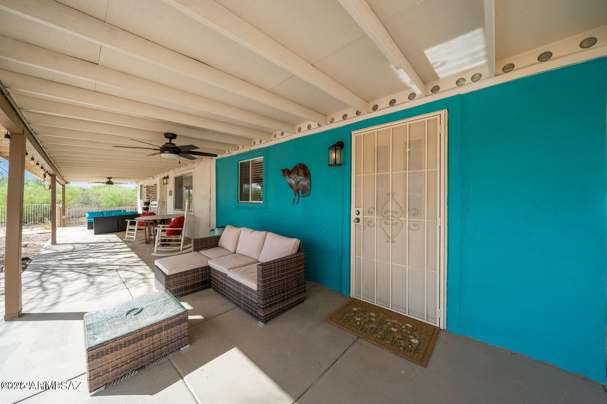 2350 West Sunkist Road Tucson, AZ 85755 - Photo 8 of 39 a living room with furniture and a large window