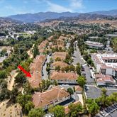 an aerial view of residential houses and outdoor space