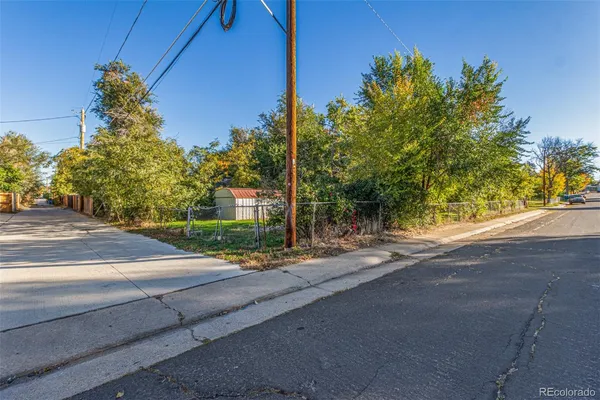 a pathway of a house with a yard
