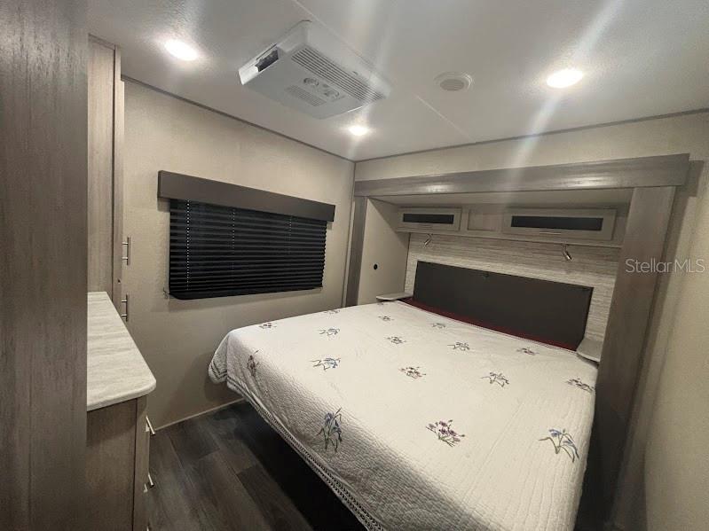 14403 Northeast 252nd Ct Road, Unit 128 Fort McCoy, FL 32134 - Photo 15 of 23 a large white bed in a room