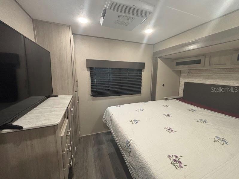 14403 Northeast 252nd Ct Road, Unit 128 Fort McCoy, FL 32134 - Photo 16 of 23 a en suite bathroom with a sink and a large mirror