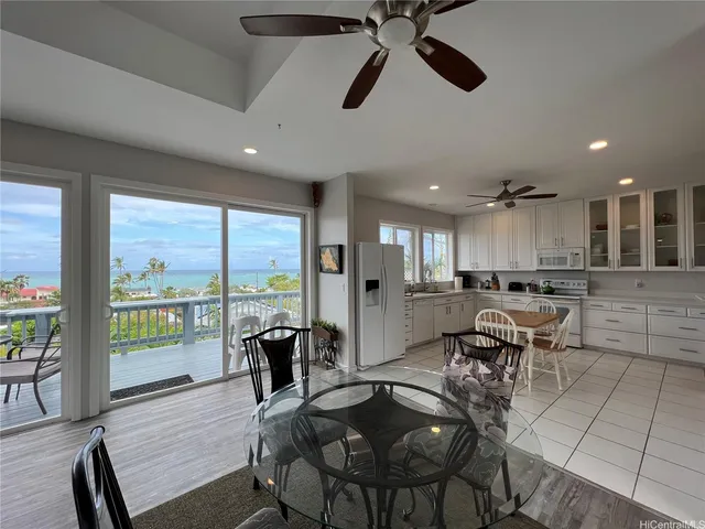 a view of a dining room with furniture window and outside view