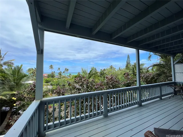 a view of a two chairs in the balcony