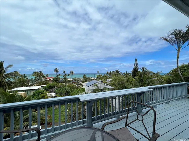 a living room with furniture tv and a large window