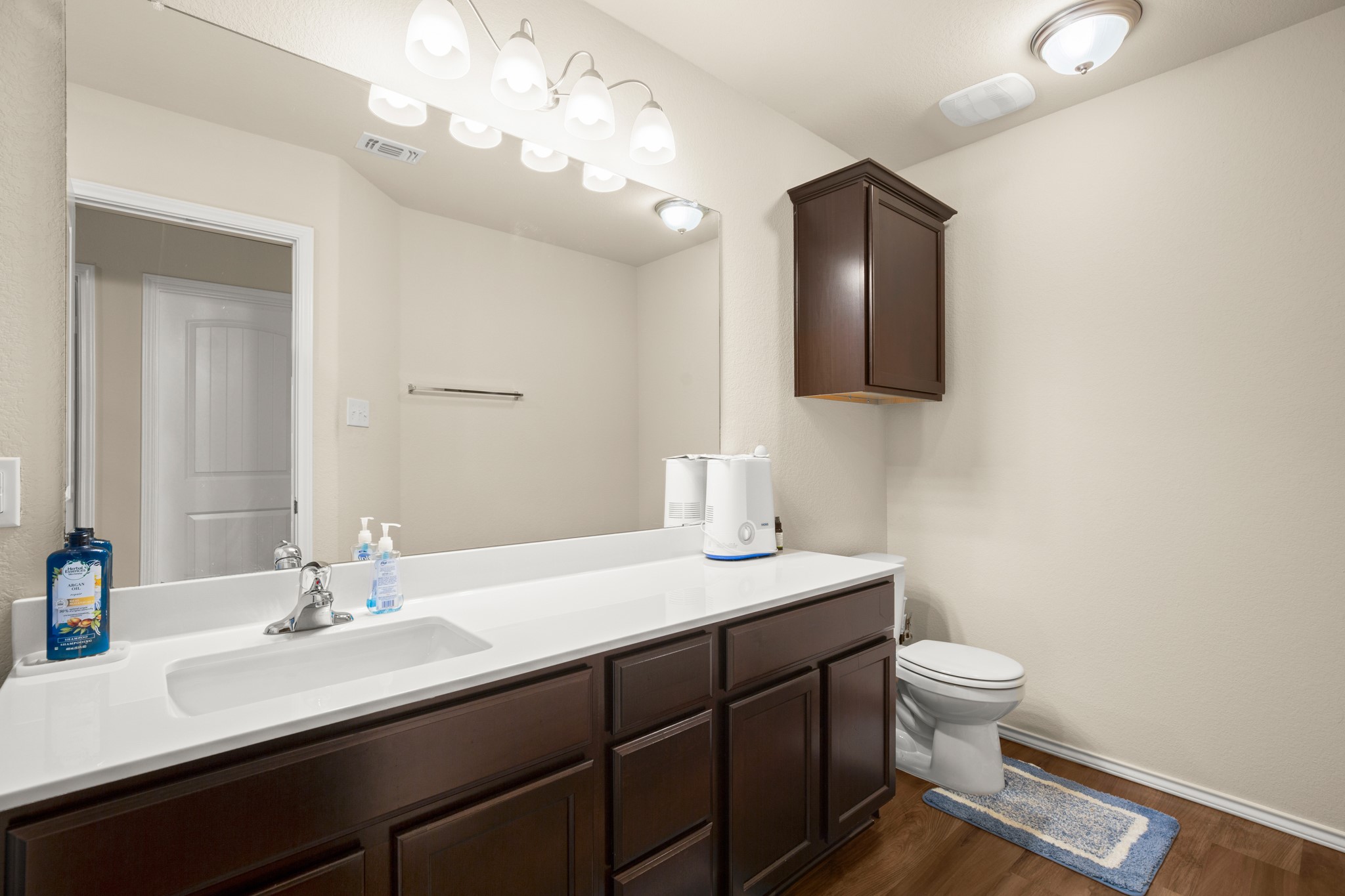 5526 Perdita Drive Belton, TX 76513 - Photo 17 of 26 Bathroom with vanity and dark wood-style flooring
