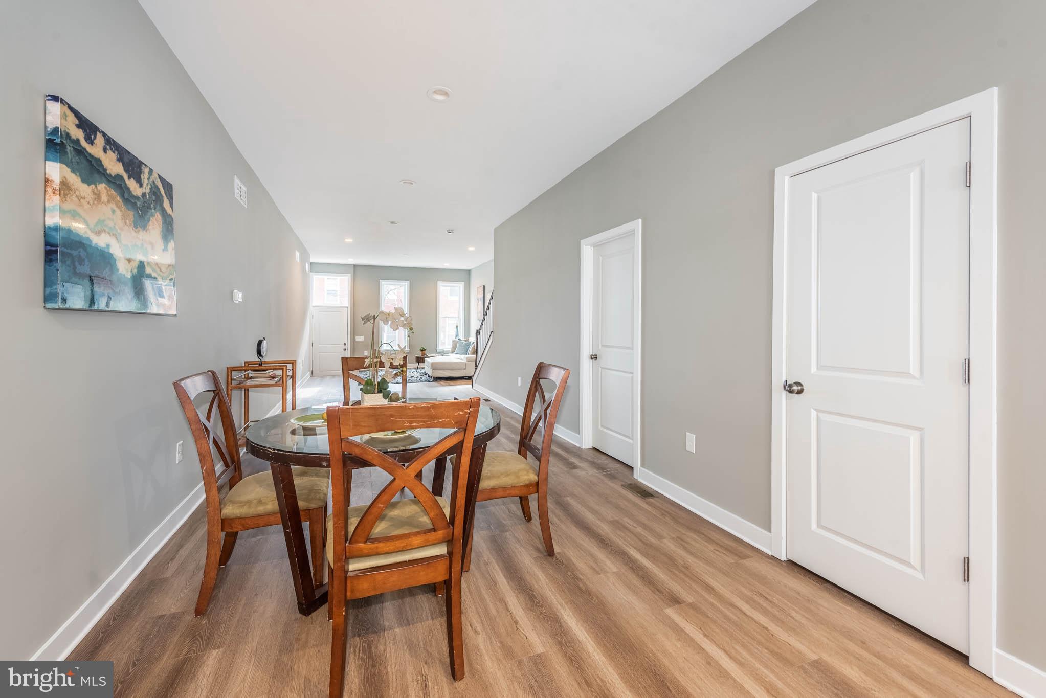 848 Edmondson Avenue Baltimore, MD 21201 - Photo 7 of 41 a dining room with furniture and wooden floor