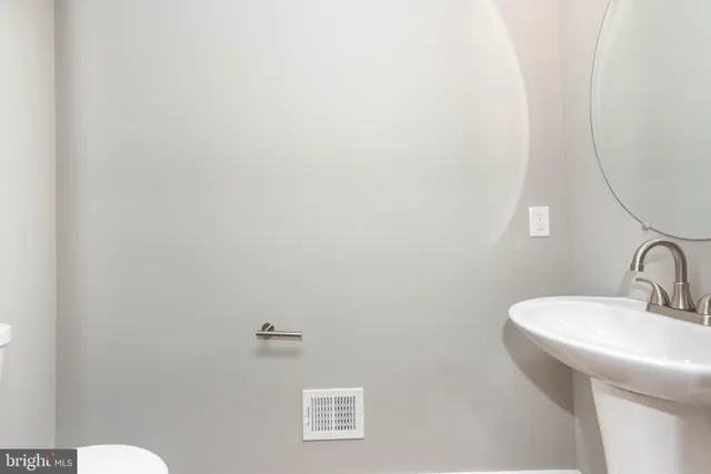 a bathroom with a sink and mirror