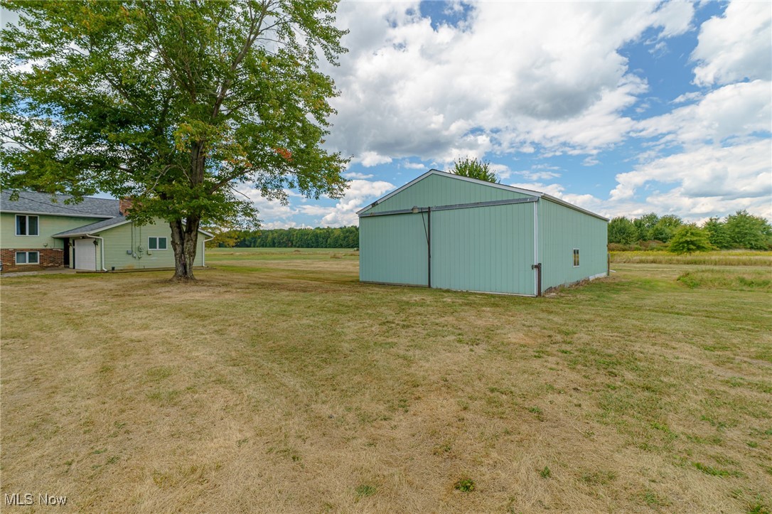 6747 Giddings Road Rootstown, OH 44272 - Photo 30 of 39 Pole barn has gravel floor with windows and also a door to back of structure