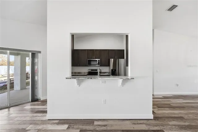 a view of living room with furniture and flat screen tv