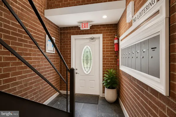 a view of a hallway with seating space