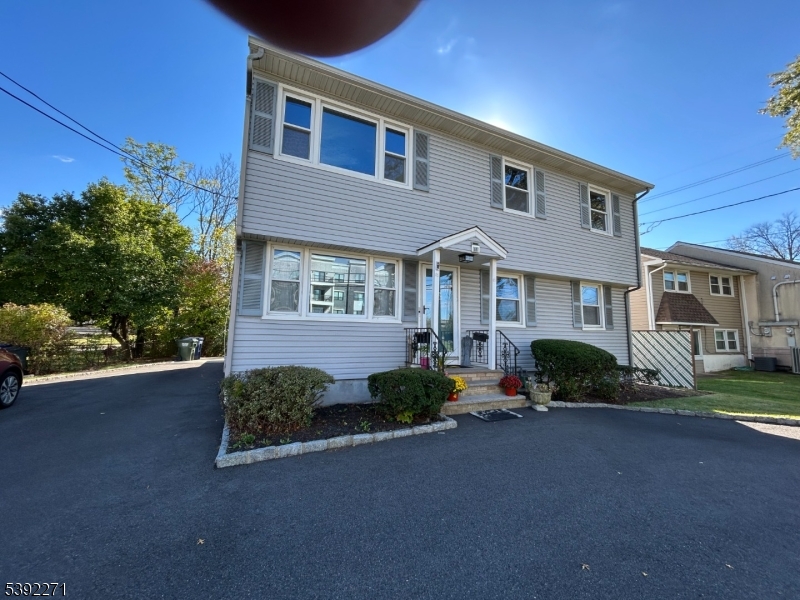85 Valley Road Clark, NJ 07066 - Photo 2 of 5 a front view of a house with garden