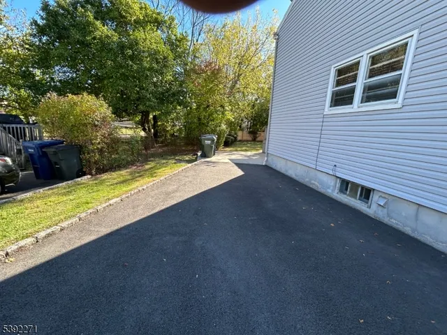 a view of a backyard of the house