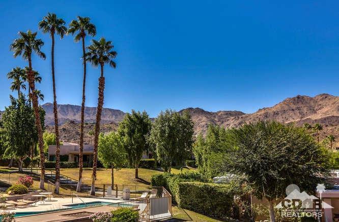 72399 Ridgecrest Lane Palm Desert, CA 92260 - Photo 1 of 34 a view of a palm tree next to a building